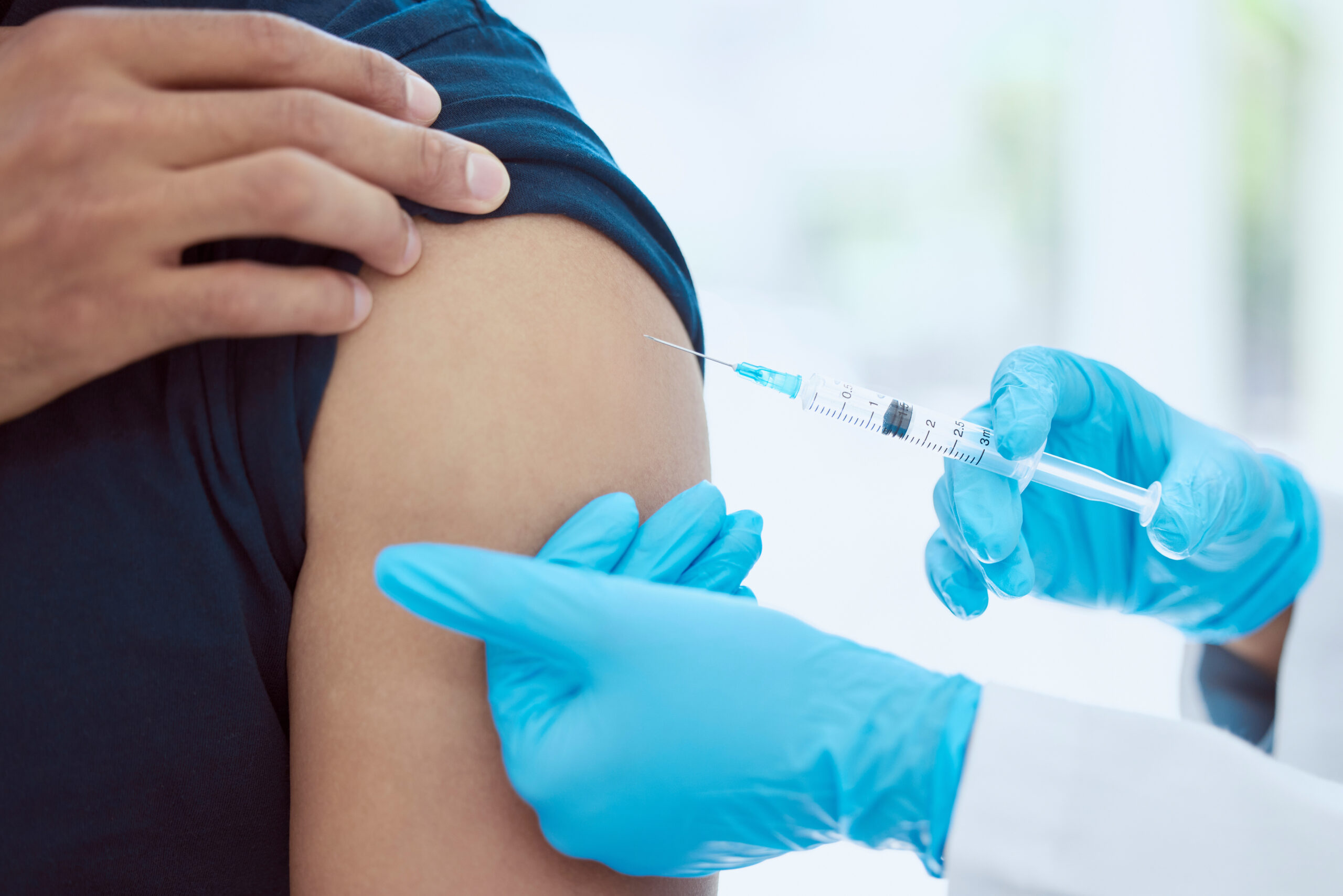 man-woman-doctor-and-covid-vaccine-in-arm-by-hosp-2022-12-10-02-13-46-utc Man, woman doctor and covid vaccine in arm by hospital, medical and consulting healthcare worker to.
